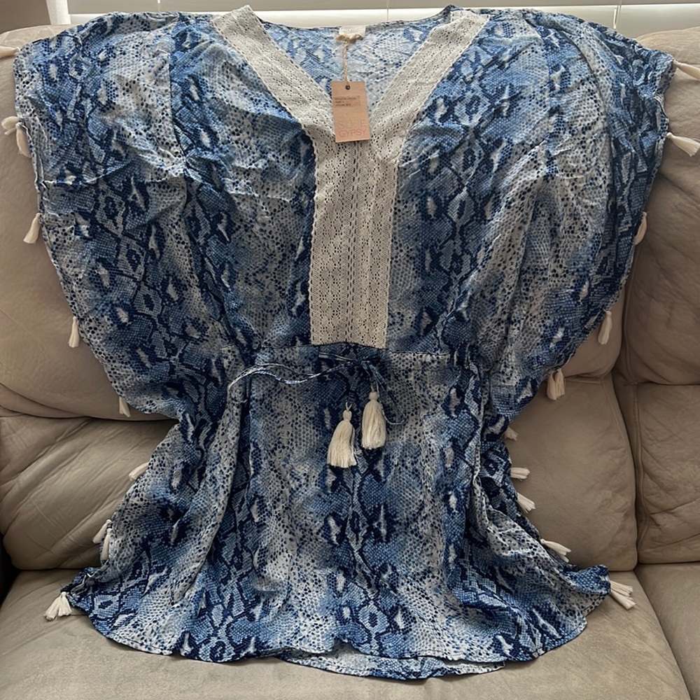 Brand New Blue swimsuit coverup with lace collar and tassels on sides.